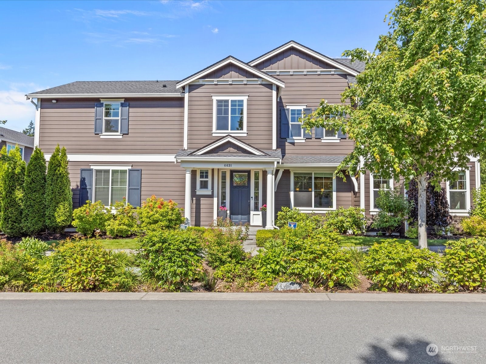 front view of a house with a yard