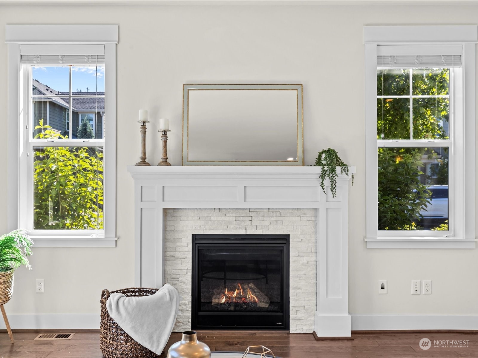 4431 187th Street Southeast Bothell, WA 98012 - Photo 20 of 39 a living room with a fireplace and a window