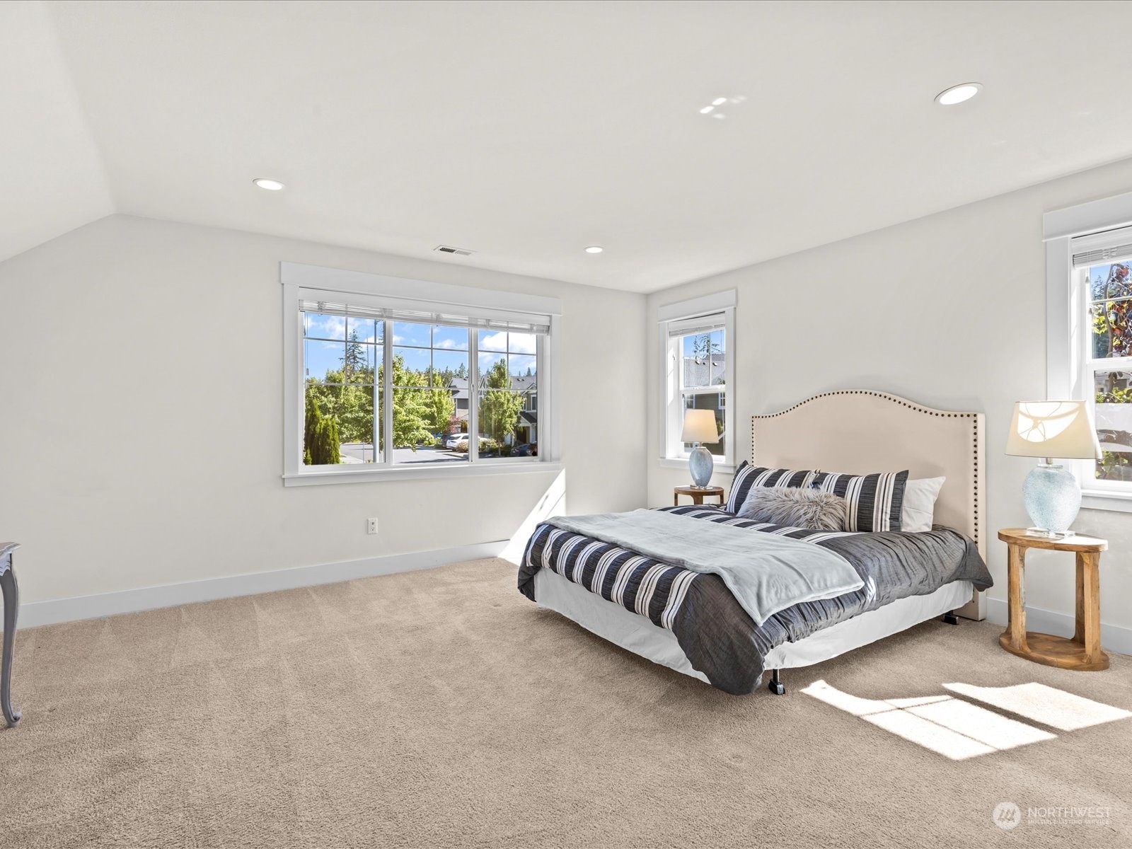 4431 187th Street Southeast Bothell, WA 98012 - Photo 26 of 39 a spacious bedroom with a bed and a window