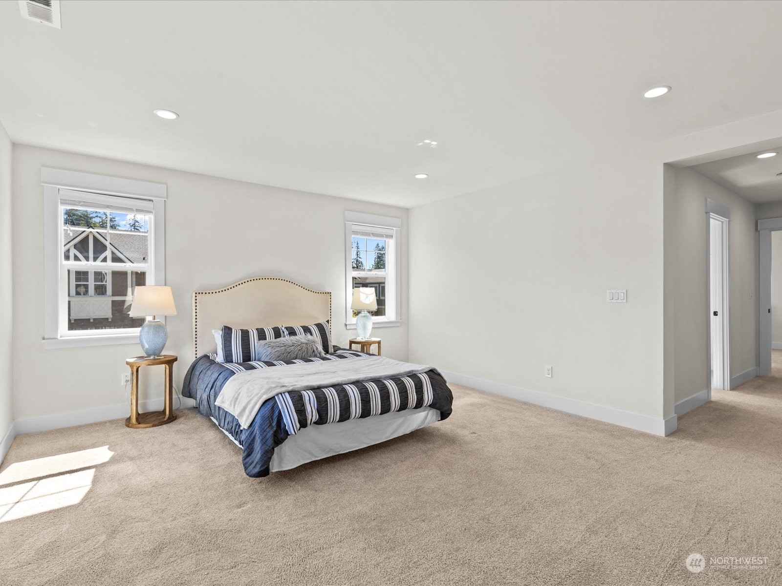 4431 187th Street Southeast Bothell, WA 98012 - Photo 27 of 39 a bedroom with a bed lamp and a window