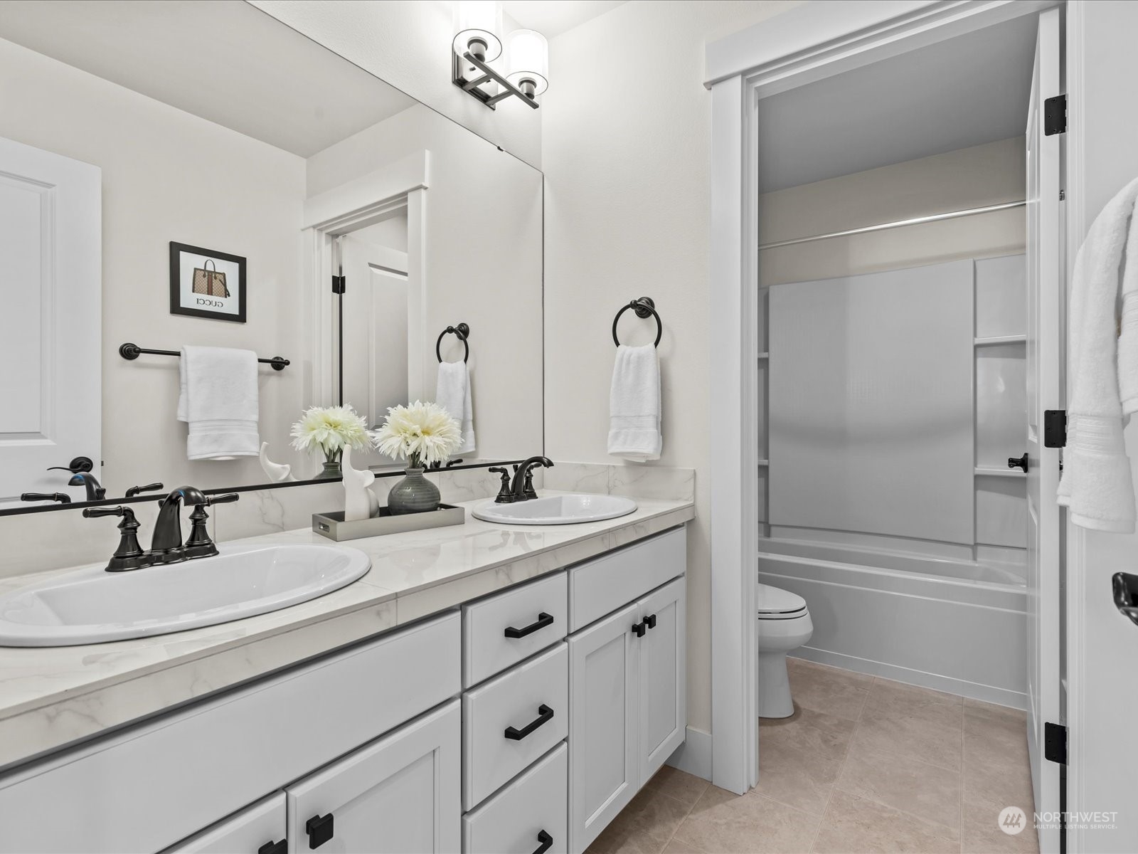 4431 187th Street Southeast Bothell, WA 98012 - Photo 33 of 39 a bathroom with a double vanity sink toilet mirror and shower
