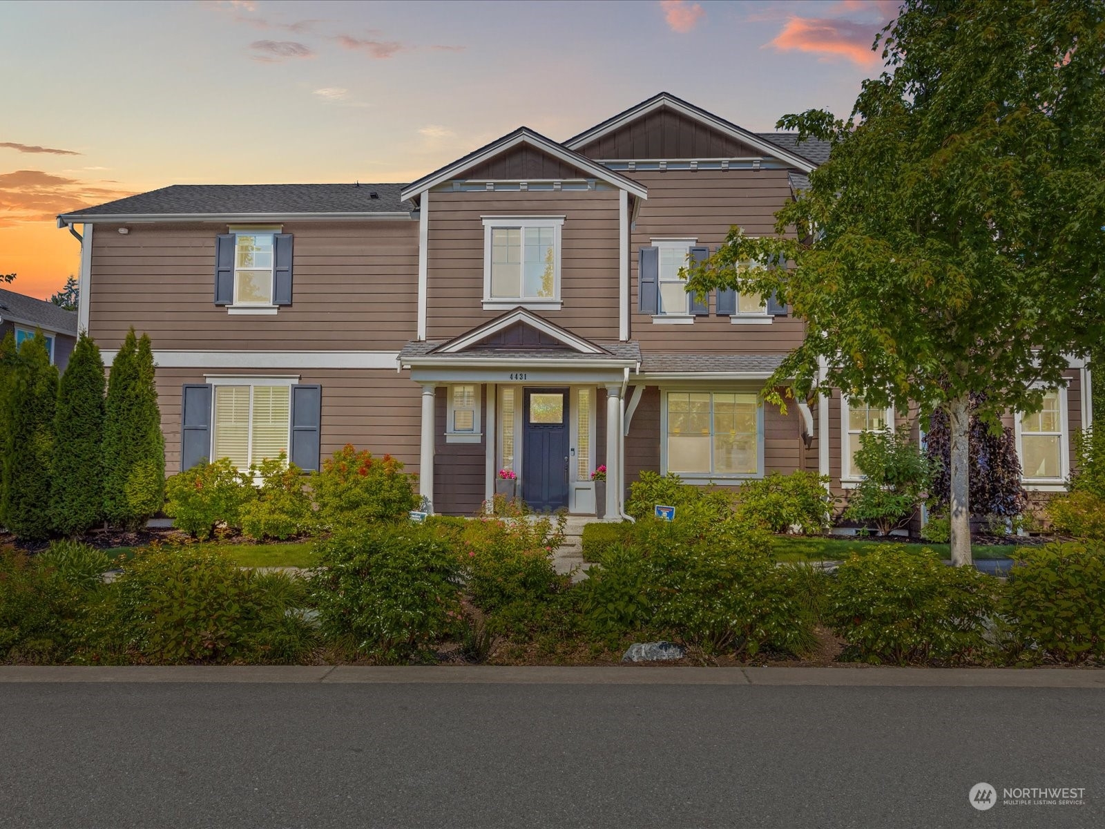 4431 187th Street Southeast Bothell, WA 98012 - Photo 39 of 39 front view of a brick house with a yard