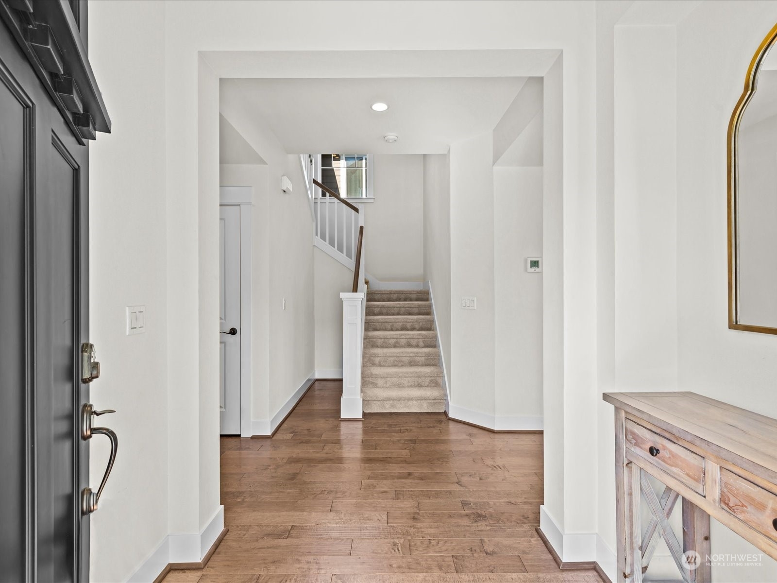 4431 187th Street Southeast Bothell, WA 98012 - Photo 5 of 39 a view of entryway and hall with wooden floor