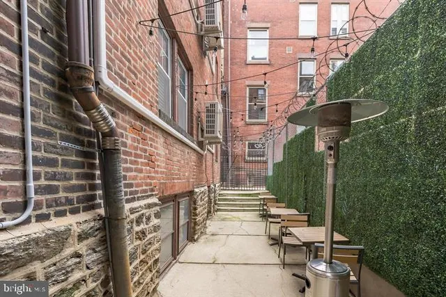a view of a brick building with many windows
