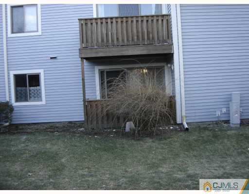 2015 Aspen Drive Plainsboro, NJ 08536 - Photo 7 of 7 a view of a wooden house with a small yard and wooden fence