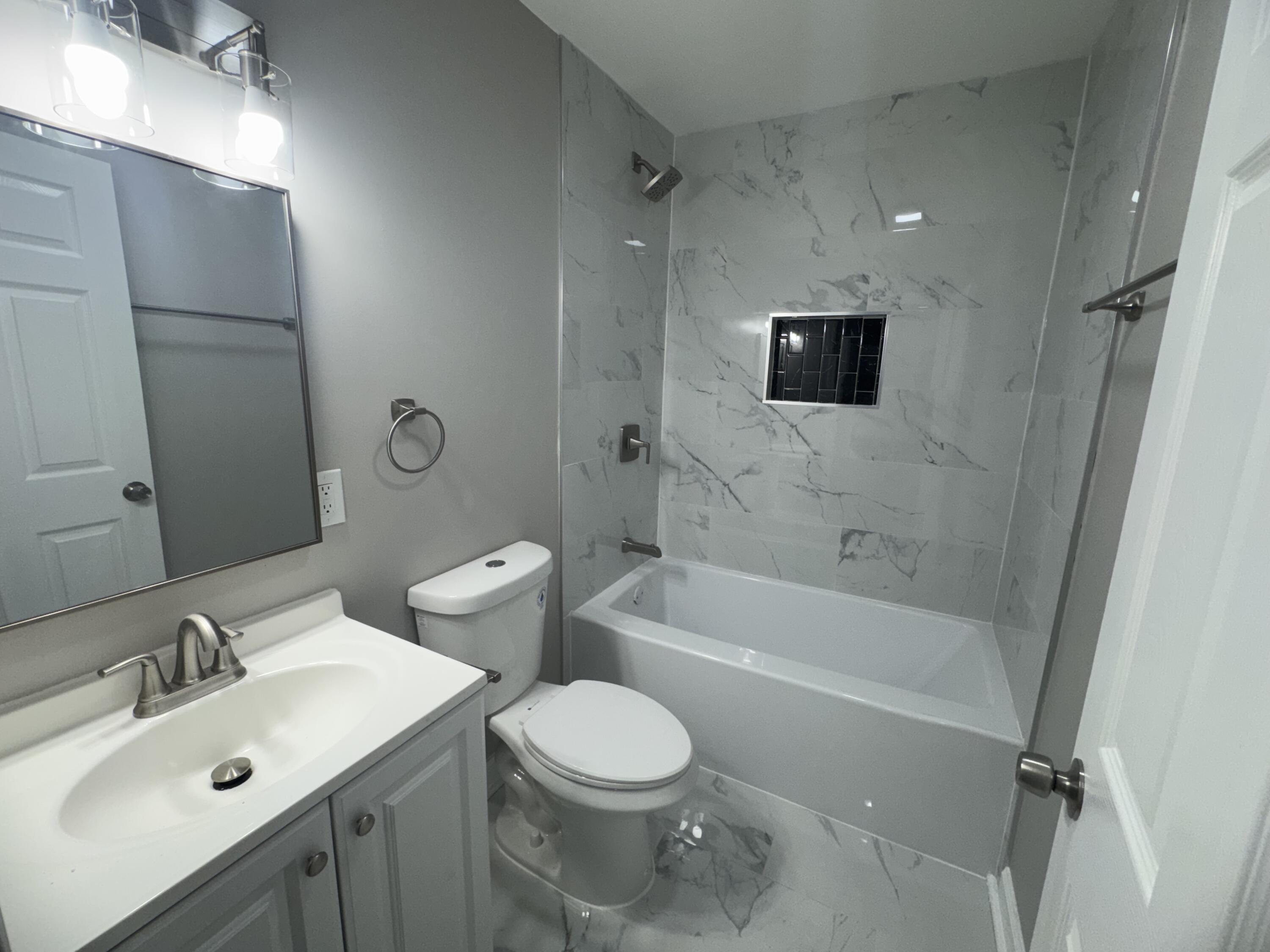 3428 Delaware Street Gary, IN 46409 - Photo 12 of 13 a bathroom with a toilet sink and bathtub