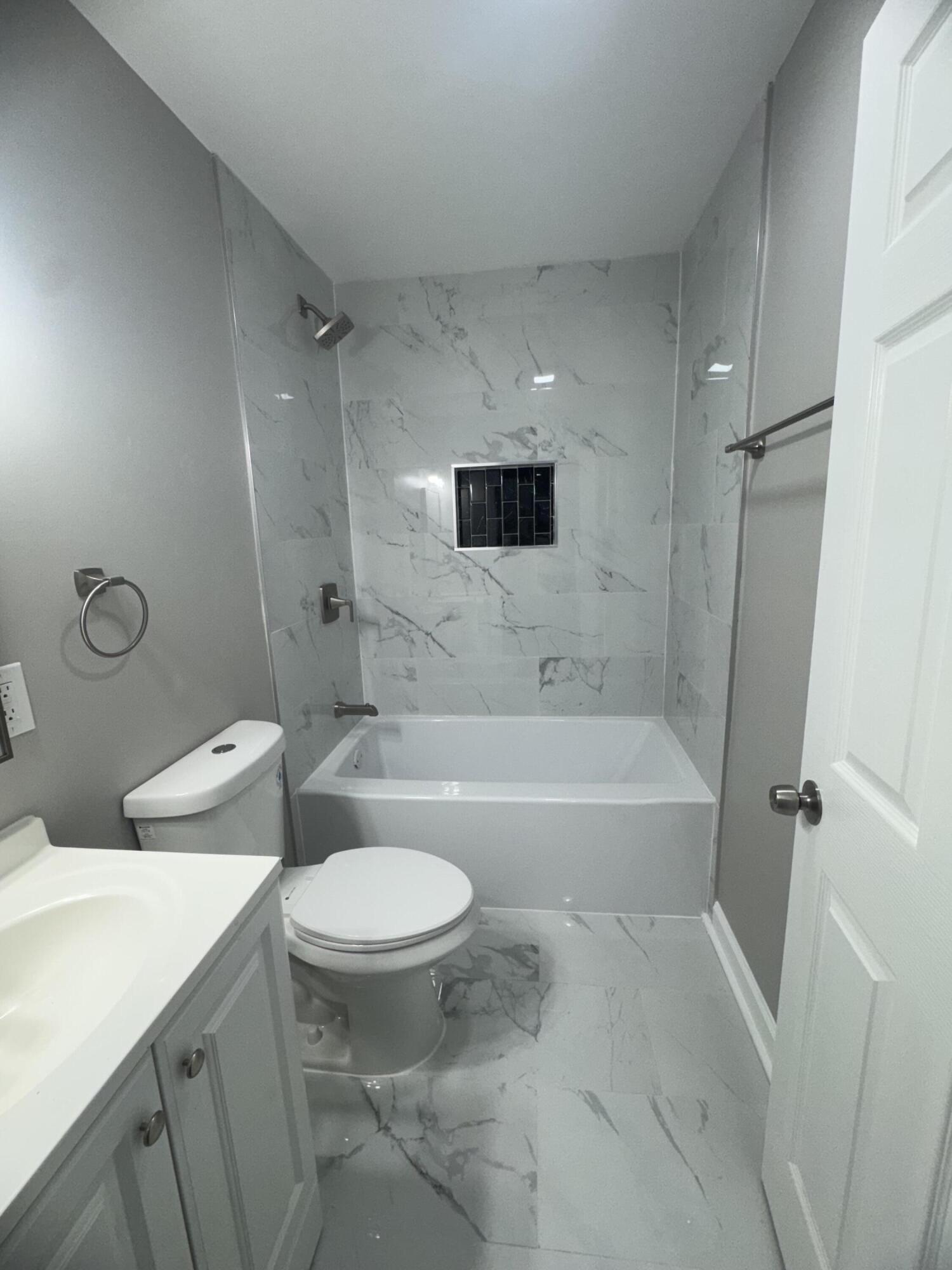 3428 Delaware Street Gary, IN 46409 - Photo 13 of 13 a bathroom with a sink a toilet and a bathtub