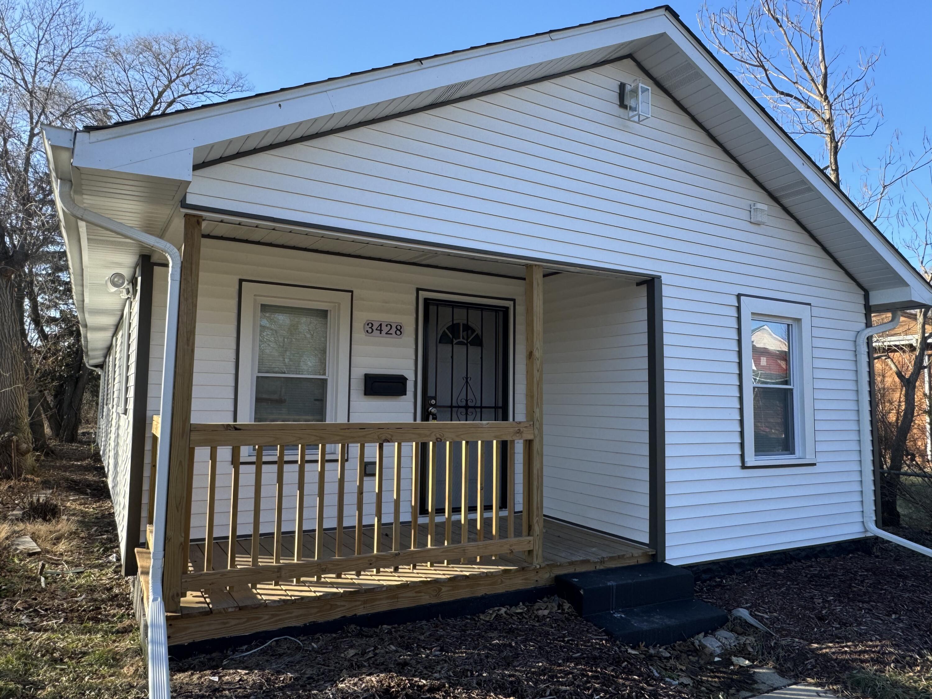 3428 Delaware Street Gary, IN 46409 - Photo 2 of 13 a view of a house with a yard