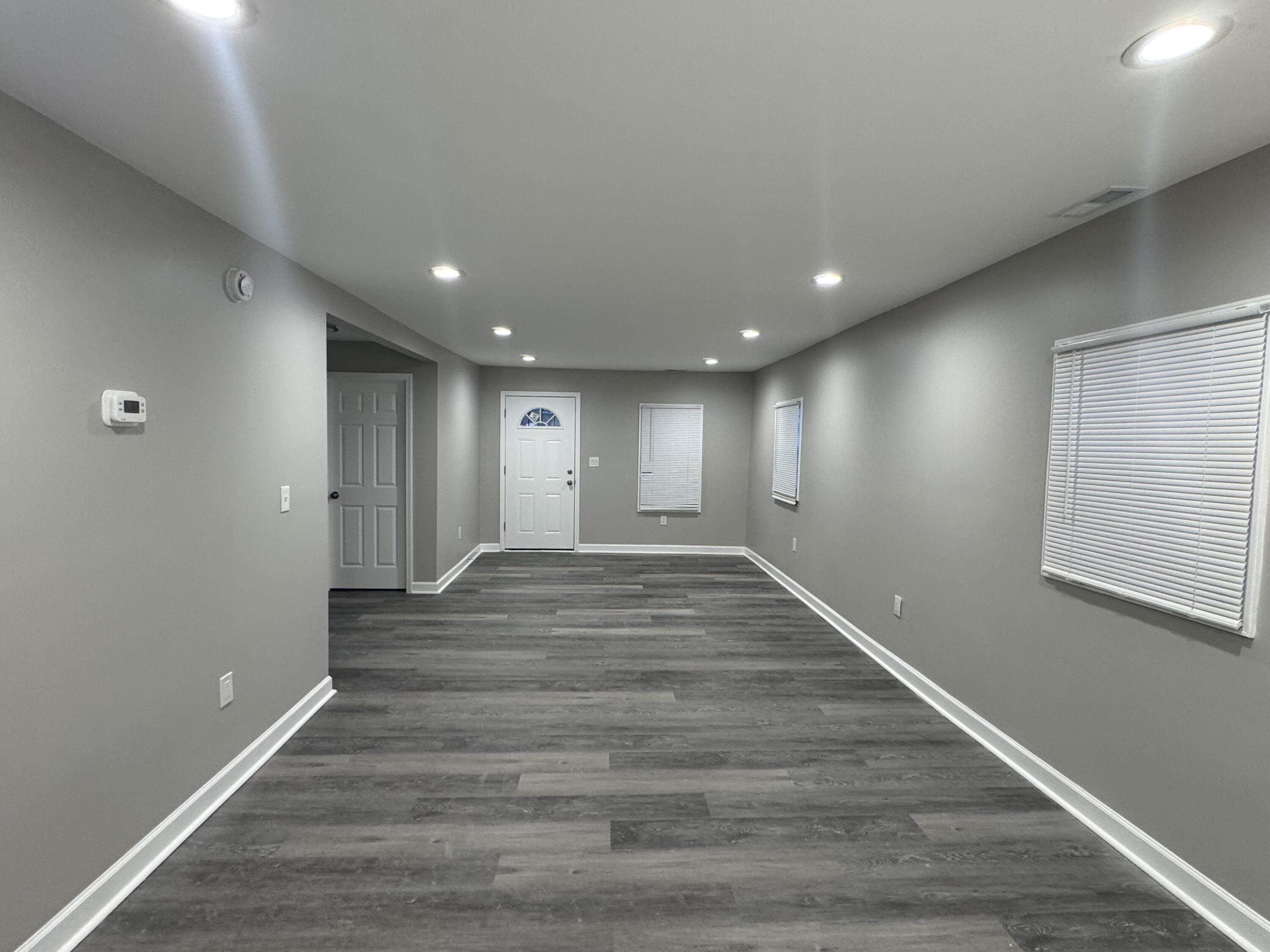 3428 Delaware Street Gary, IN 46409 - Photo 3 of 13 a view of an empty room with wooden floor