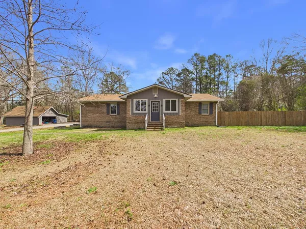 a house with trees in front of it