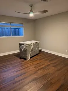 a view of room with wooden floor