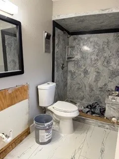 a view of a room with wooden floor