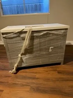 a view of room with wooden floor and ceiling fan