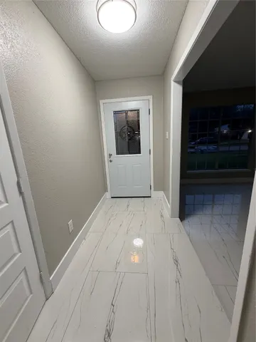a view of room with window and ceiling fan