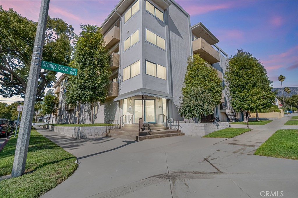 601 East Orange Grove Avenue, Unit 106 Burbank, CA 91501 - Photo 2 of 27 a multi story building with trees in front of it