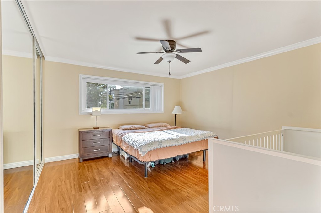 601 East Orange Grove Avenue, Unit 106 Burbank, CA 91501 - Photo 25 of 27 a bedroom with a bed and a window