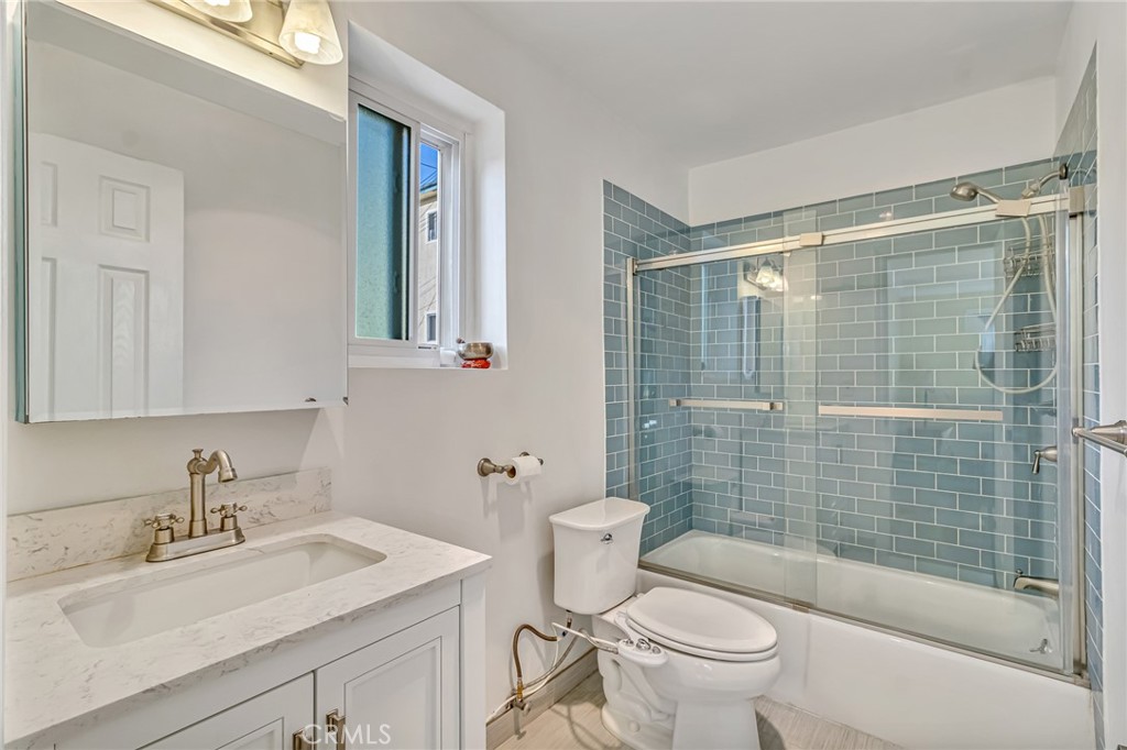 601 East Orange Grove Avenue, Unit 106 Burbank, CA 91501 - Photo 27 of 27 a bathroom with a sink toilet and shower