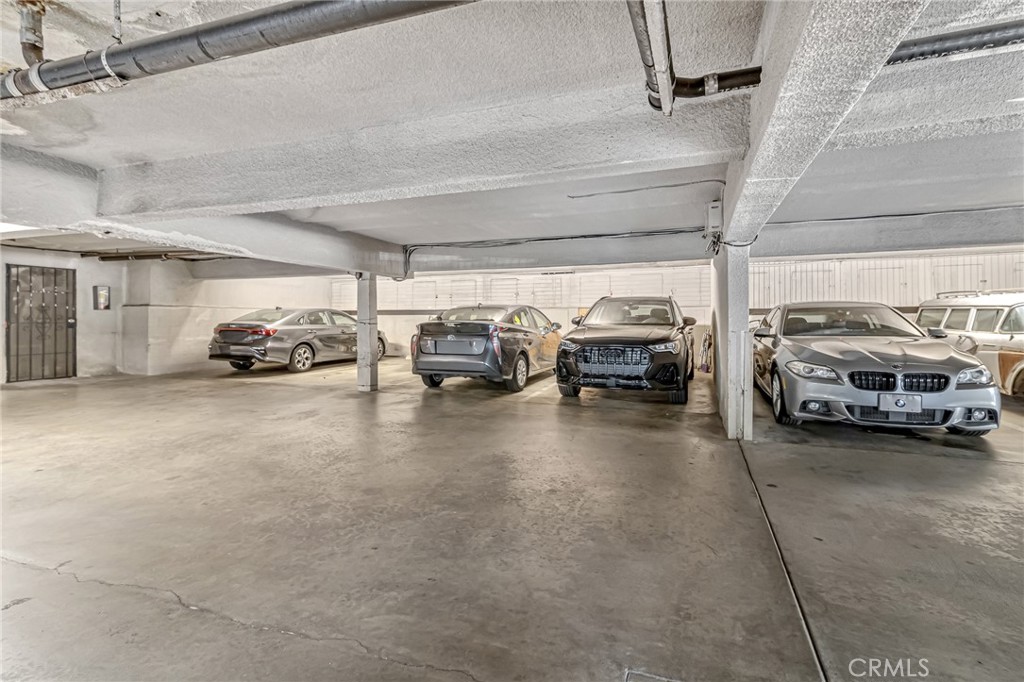 601 East Orange Grove Avenue, Unit 106 Burbank, CA 91501 - Photo 5 of 27 a view of parking garage with cars
