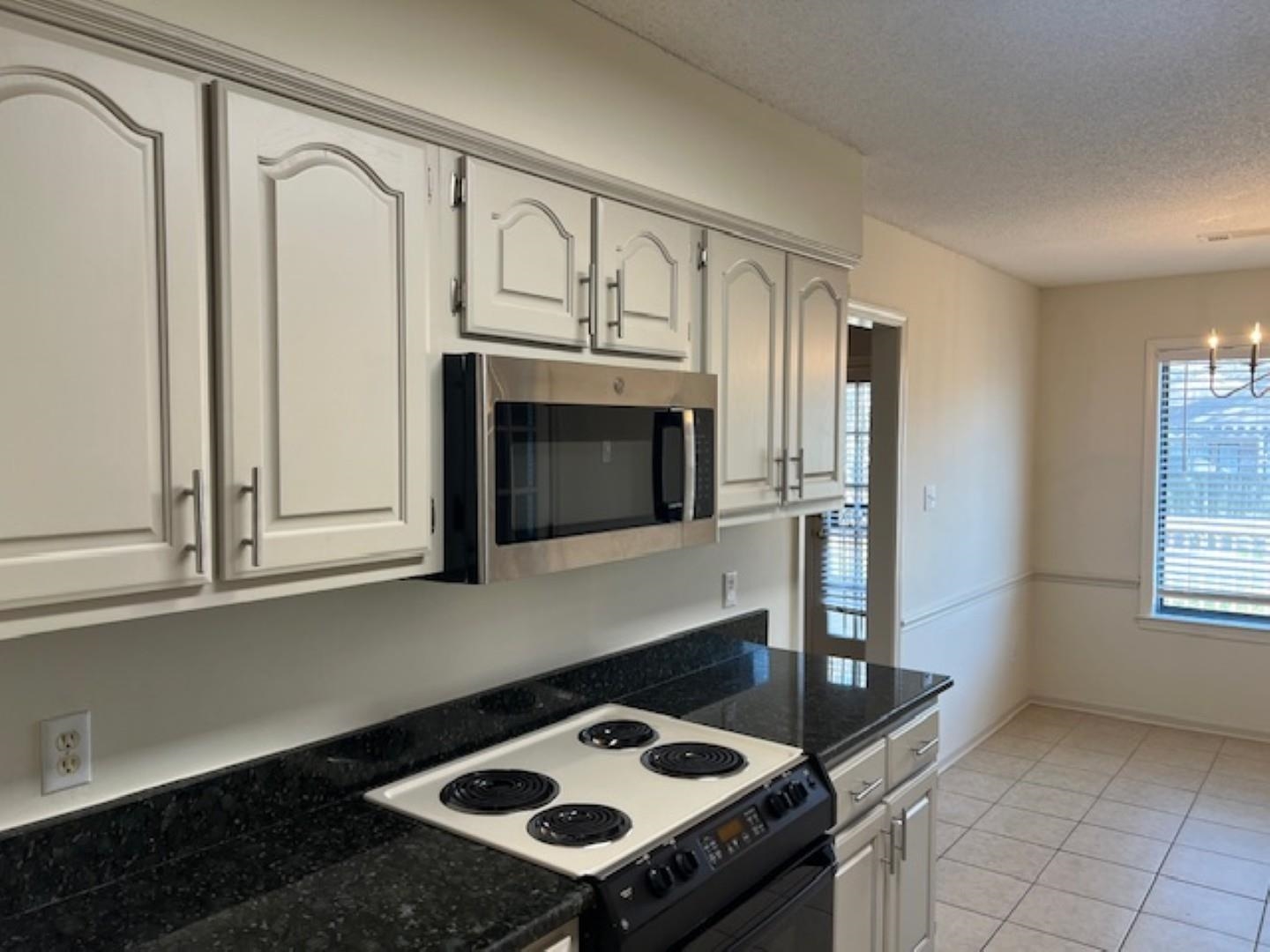 290 Rose Trellis Road Collierville, TN 38017 - Photo 7 of 17 a stove top oven sitting inside of a kitchen
