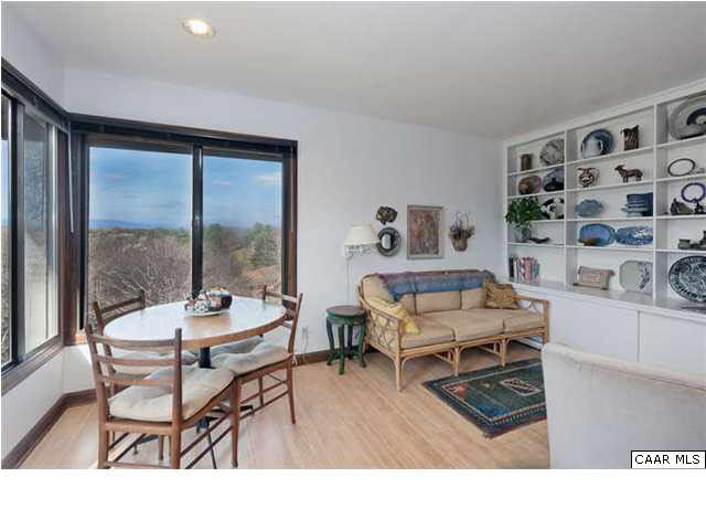 1747 Lambs Road Charlottesville, VA 22901 - Photo 13 of 24 a living room with furniture a rug and a table