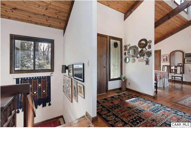 1747 Lambs Road Charlottesville, VA 22901 - Photo 10 of 24 a living room with furniture and wooden floor