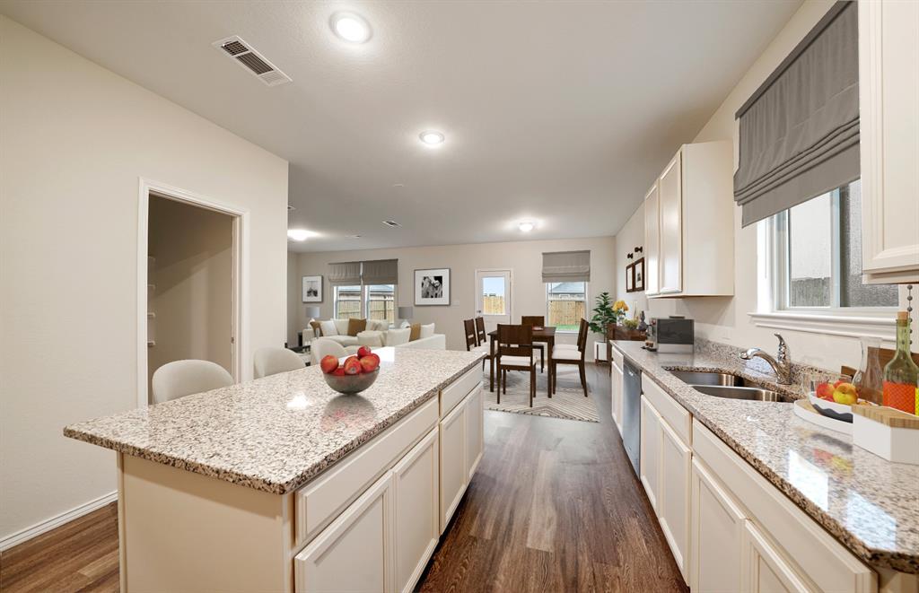 2106 Sugar Maple Lane Forney, TX 75126 - Photo 7 of 12 *Model Representation - Spacious kitchen with eat-in bartop island