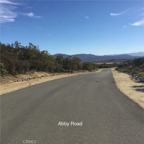 a view of a house with backyard porch and sitting area