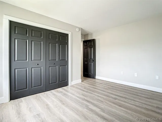 a view of a livingroom with wooden floor
