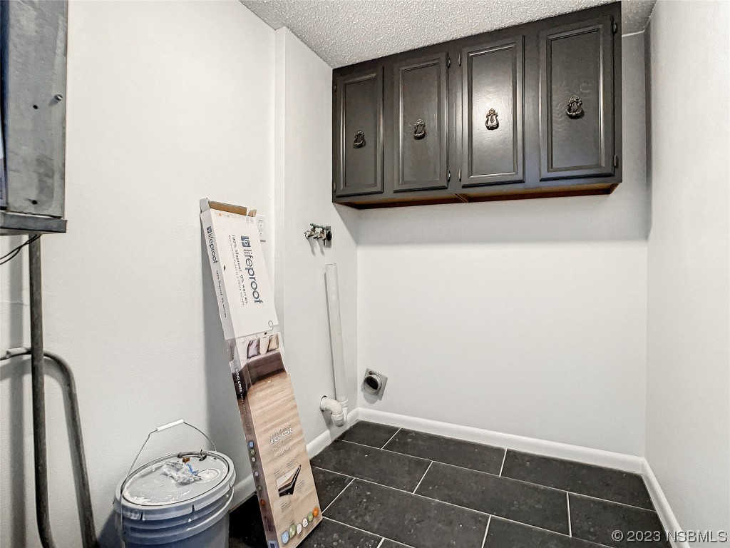 4435 South Atlantic Avenue, Unit 311 Ponce Inlet, FL 32127 - Photo 30 of 44 a bathroom with a sink a toilet and a mirror