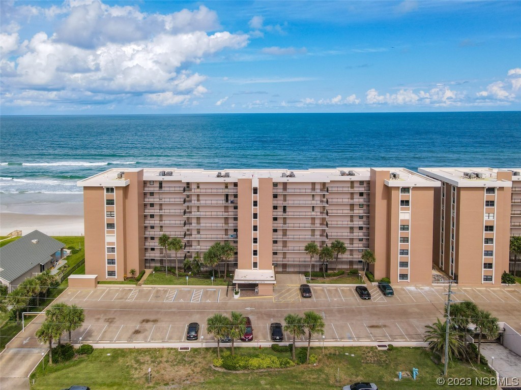 4435 South Atlantic Avenue, Unit 311 Ponce Inlet, FL 32127 - Photo 3 of 44 a view of building with yard