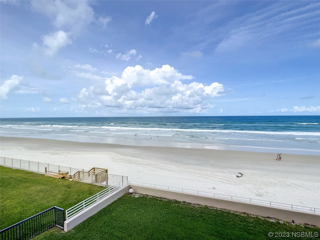 4435 South Atlantic Avenue, Unit 311 Ponce Inlet, FL 32127 - Photo 36 of 44 a view of a lake from a yard