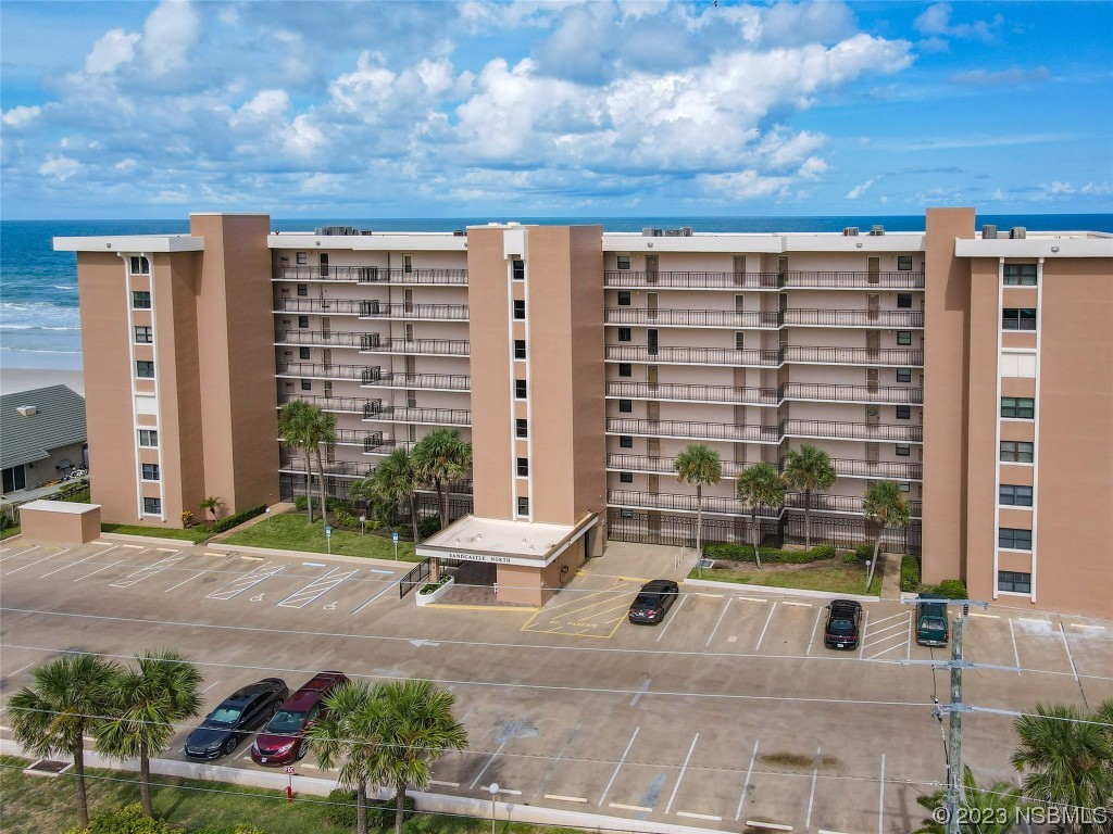 4435 South Atlantic Avenue, Unit 311 Ponce Inlet, FL 32127 - Photo 6 of 44 a view of building with yard and staircase