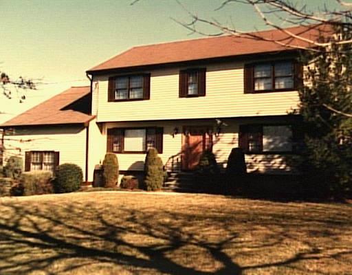 30 Lewis Road Trumbull, CT 06611 - Photo 1 of 1 a front view of a house with a yard
