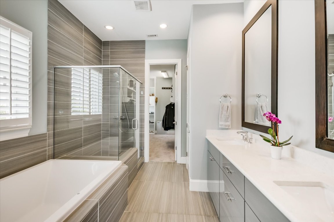 1023 Juniper Street Austin, TX 78702 - Photo 13 of 31 a bathroom with a tub sink and shower