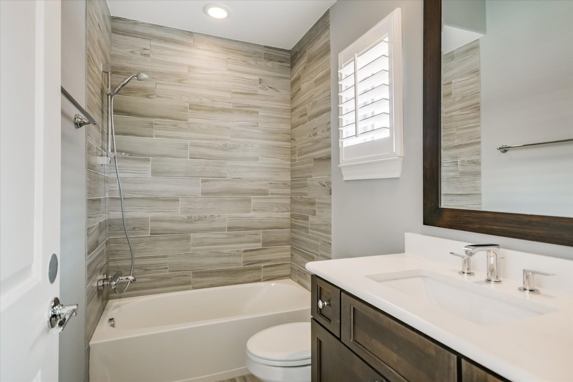 1023 Juniper Street Austin, TX 78702 - Photo 21 of 31 a bathroom with a sink a toilet and shower