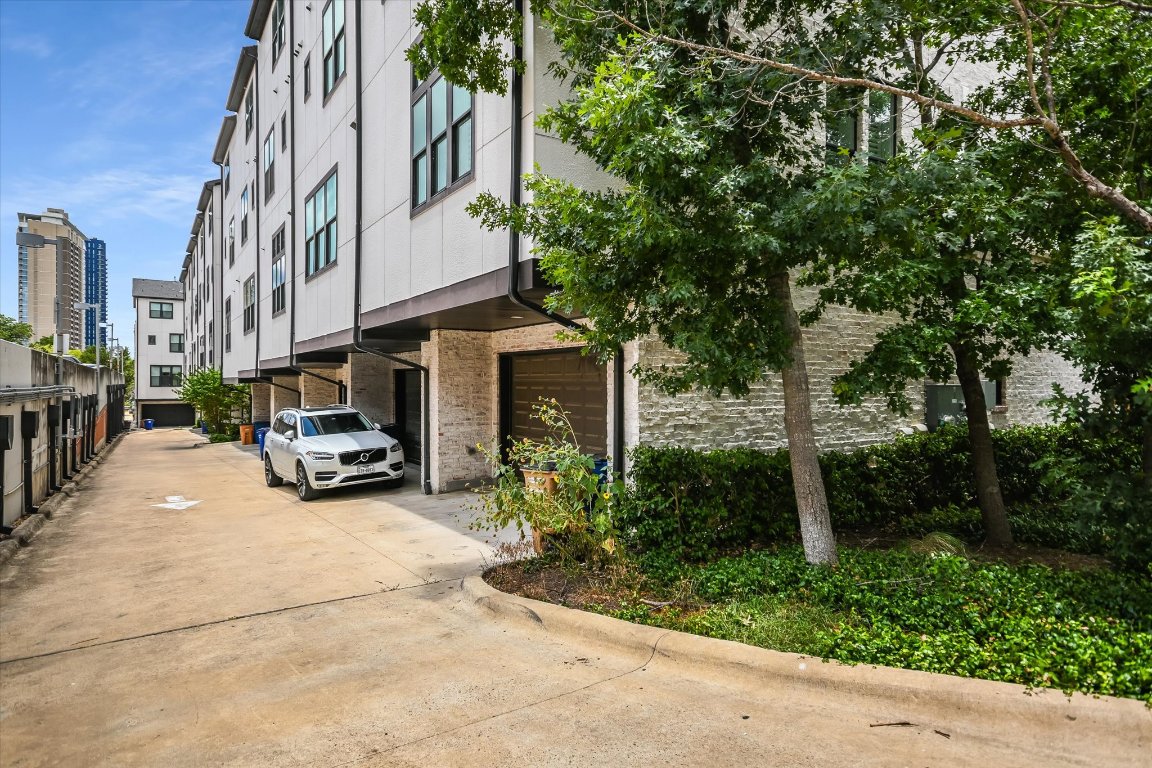 1023 Juniper Street Austin, TX 78702 - Photo 28 of 31 a view of a street with potted plants and a bench