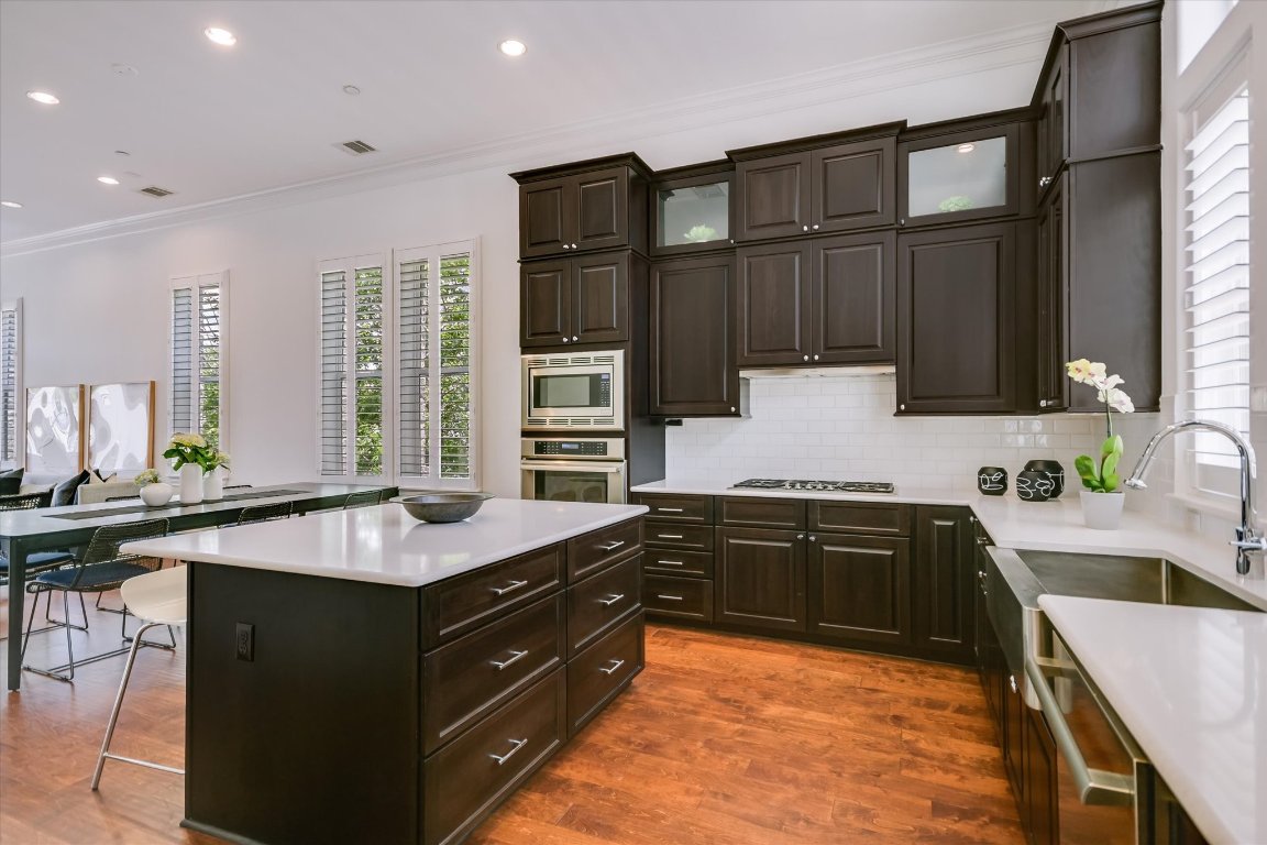 1023 Juniper Street Austin, TX 78702 - Photo 4 of 31 a kitchen with a sink stove and cabinets