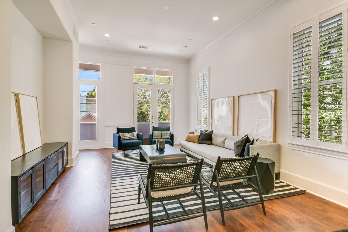 1023 Juniper Street Austin, TX 78702 - Photo 6 of 31 a living room with furniture and a window