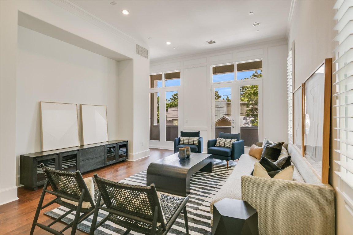 1023 Juniper Street Austin, TX 78702 - Photo 7 of 31 a living room with furniture and a large window