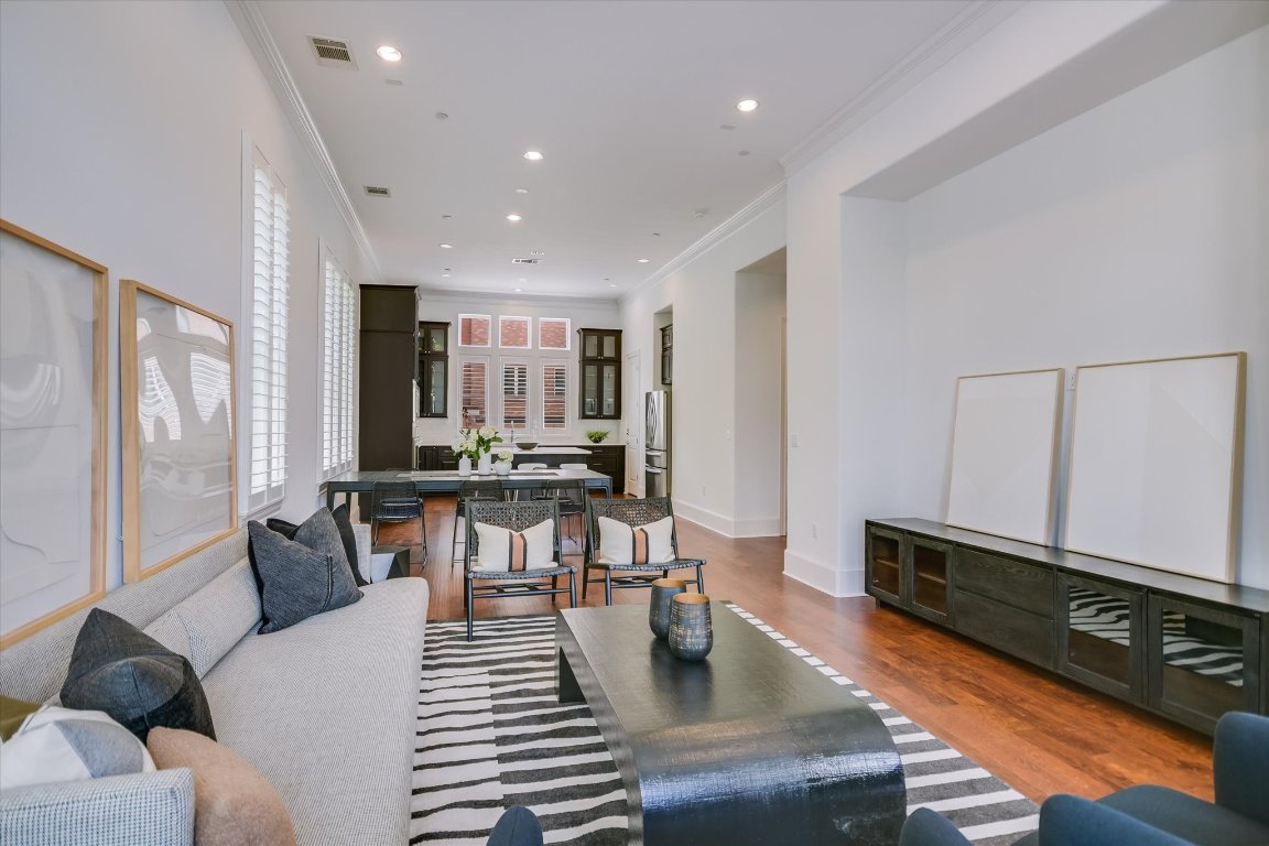 1023 Juniper Street Austin, TX 78702 - Photo 8 of 31 a living room with furniture and a wooden floor