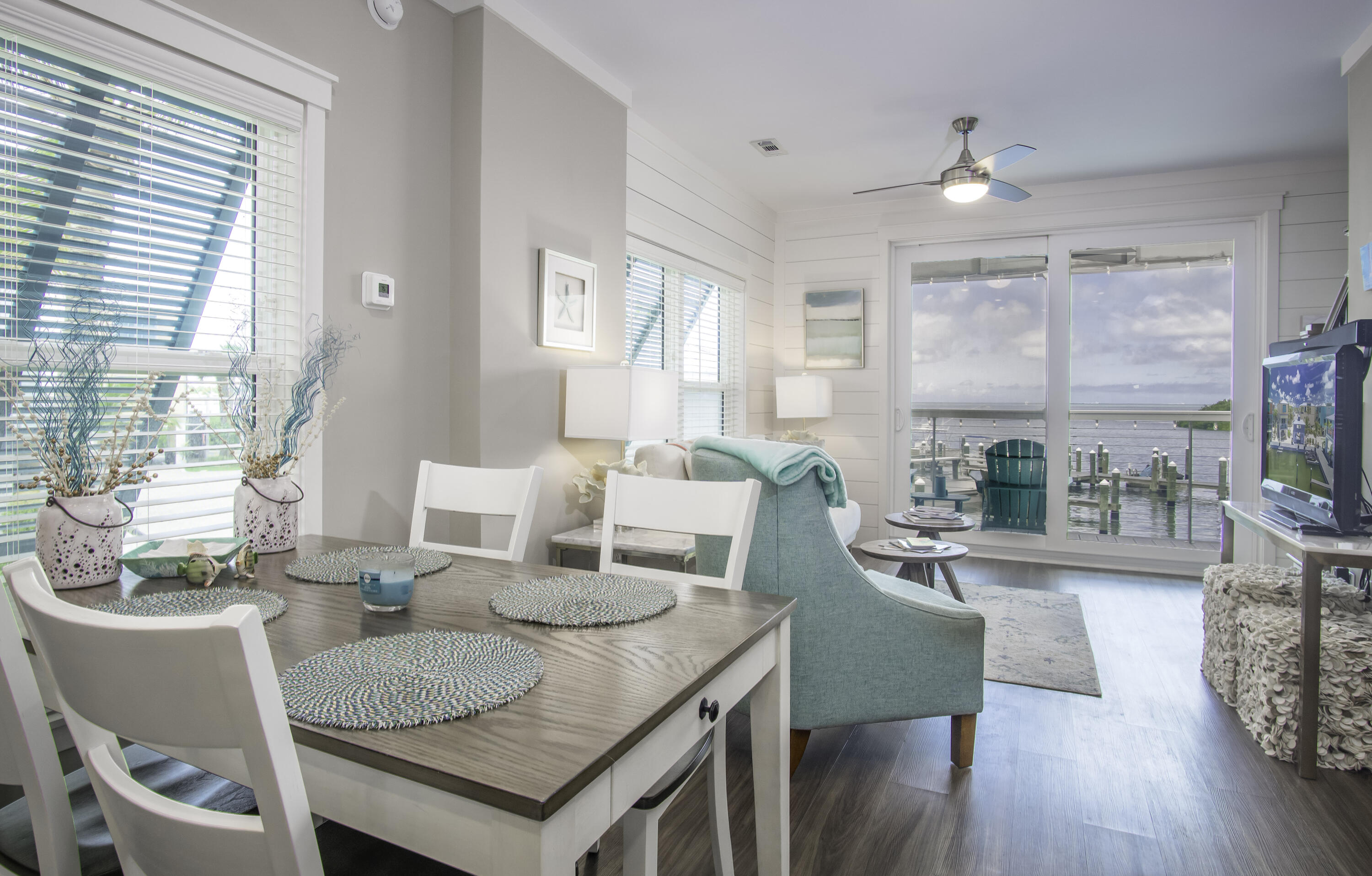 101 11th Street, Unit 11 Marathon, FL 33050 - Photo 20 of 67 a view of a dining room with furniture window and wooden floor
