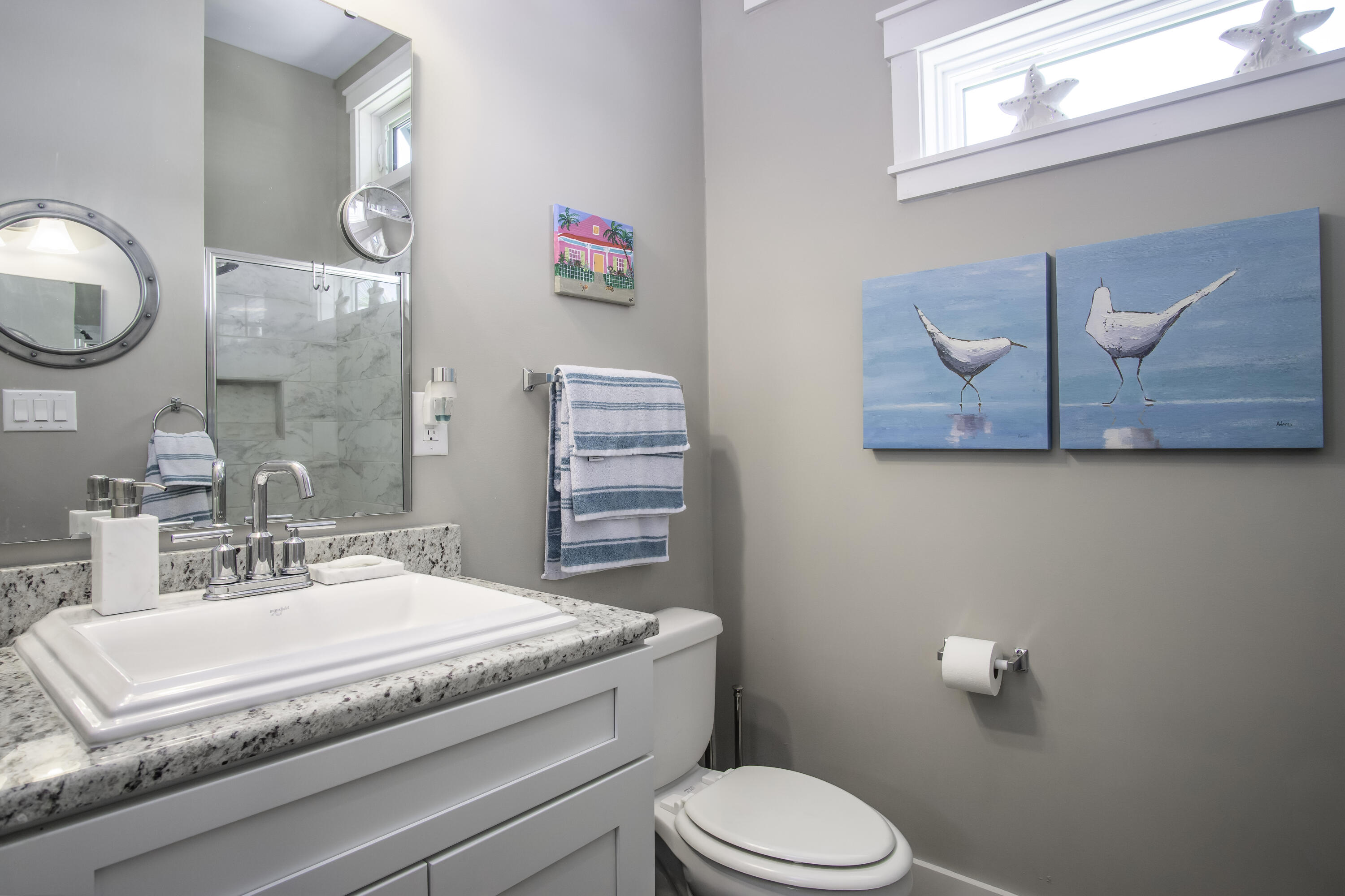 101 11th Street, Unit 11 Marathon, FL 33050 - Photo 26 of 67 a bathroom with a granite countertop sink mirror vanity and toilet