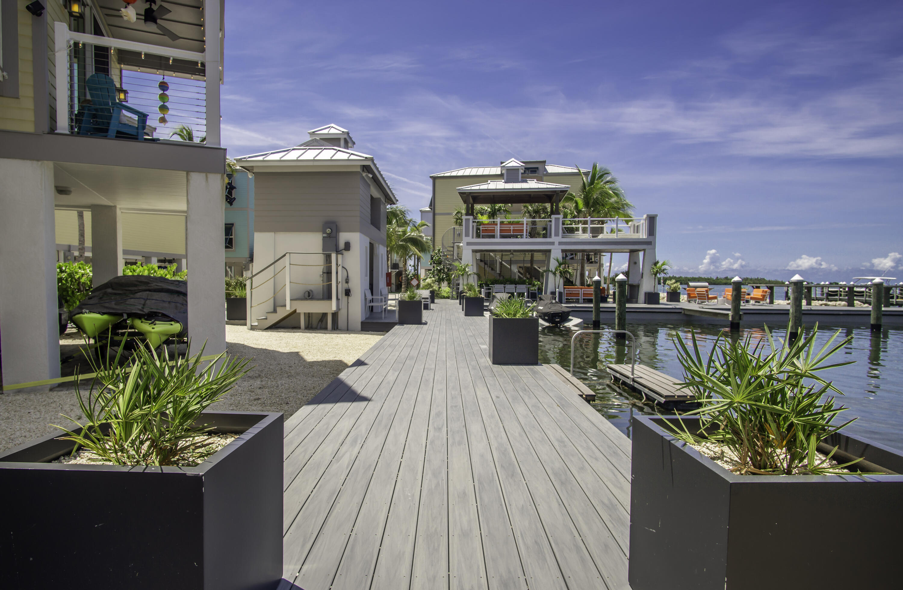 101 11th Street, Unit 11 Marathon, FL 33050 - Photo 40 of 67 a swimming pool with outdoor seating and plants