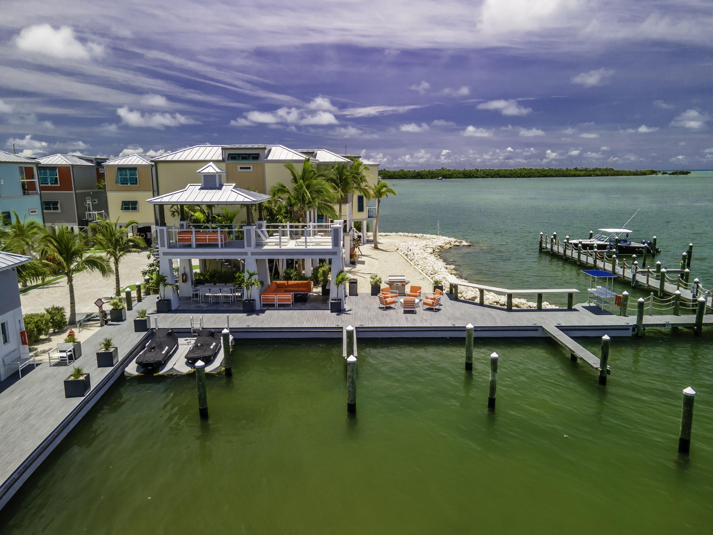 101 11th Street, Unit 11 Marathon, FL 33050 - Photo 66 of 67 a table and chairs sitting in the middle of a lake