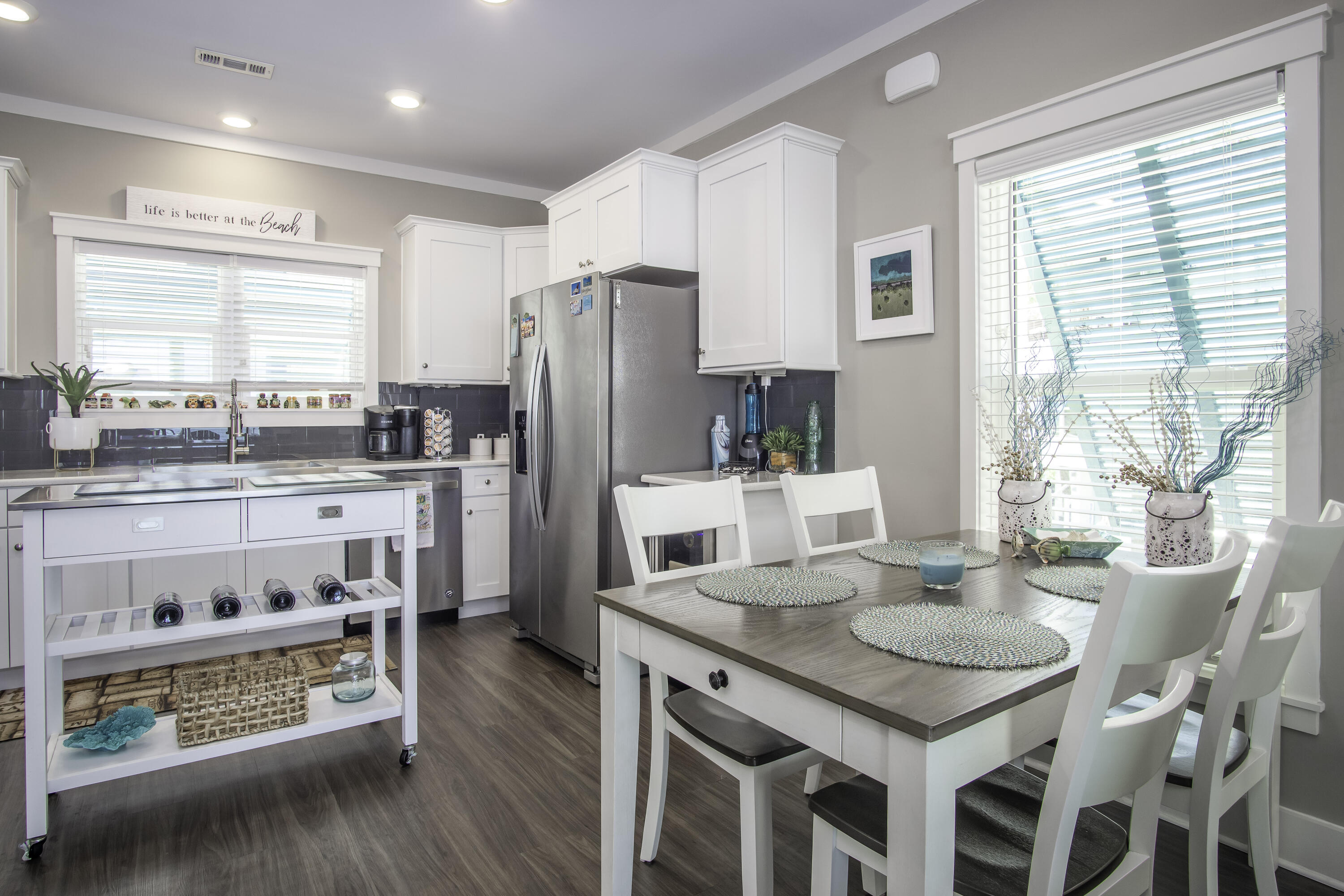 101 11th Street, Unit 11 Marathon, FL 33050 - Photo 9 of 67 a kitchen with stainless steel appliances granite countertop a table chairs stove a refrigerator and cabinets