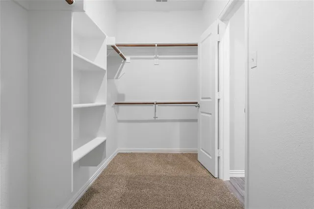 a view of an empty walk in closet