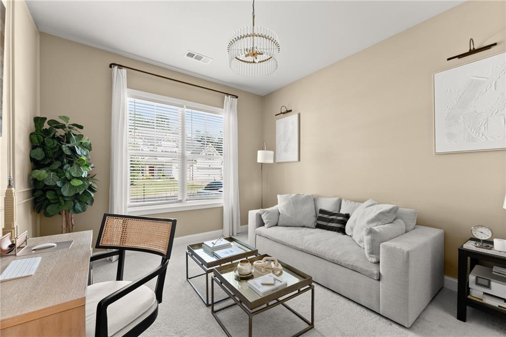 3675 Andover Street Cumming, GA 30028 - Photo 11 of 52 a living room with furniture and a window
