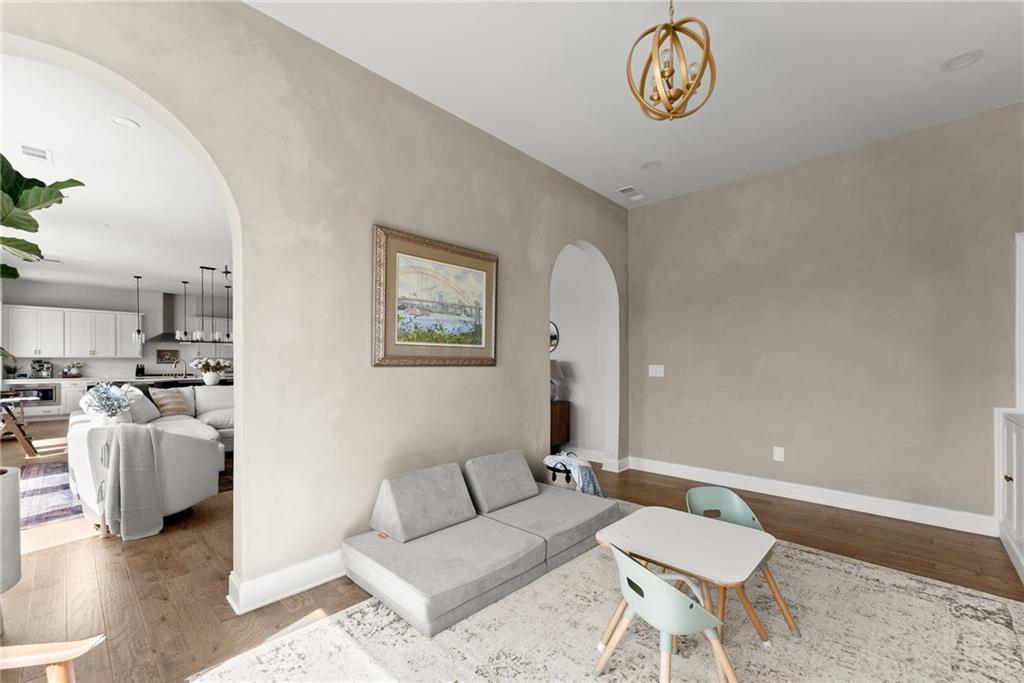 3675 Andover Street Cumming, GA 30028 - Photo 13 of 52 a living room with furniture and a table