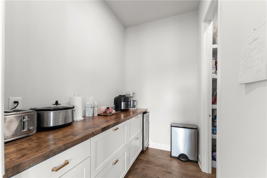 3675 Andover Street Cumming, GA 30028 - Photo 20 of 52 a kitchen with stainless steel appliances granite countertop a sink and a stove