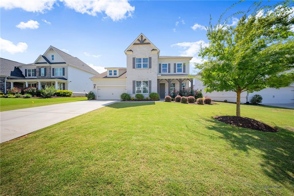 3675 Andover Street Cumming, GA 30028 - Photo 2 of 52 a front view of a house with a yard